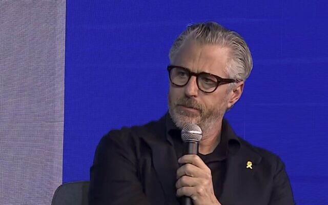 Casey Wasserman, chair of the LA 2028 Olympics organizing committee, speaks at an event in Tel Aviv on December 11, 2025. (Screen capture/Sport5)